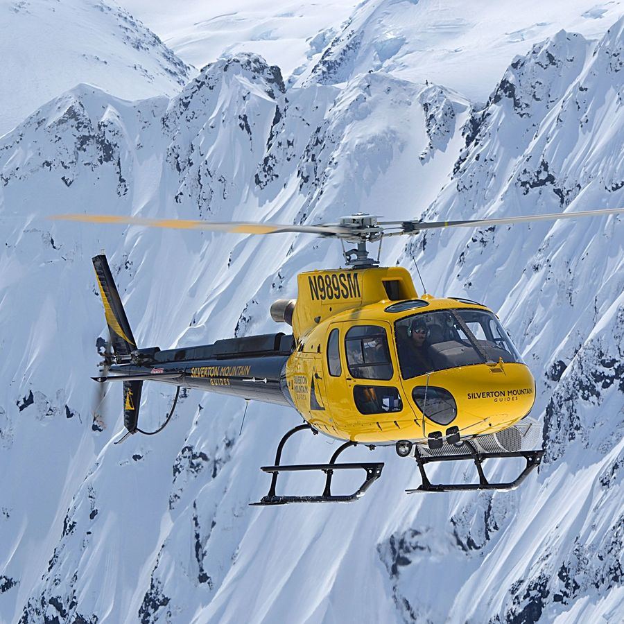 SMG H125 helicopter landed on an Alaska snow ridge