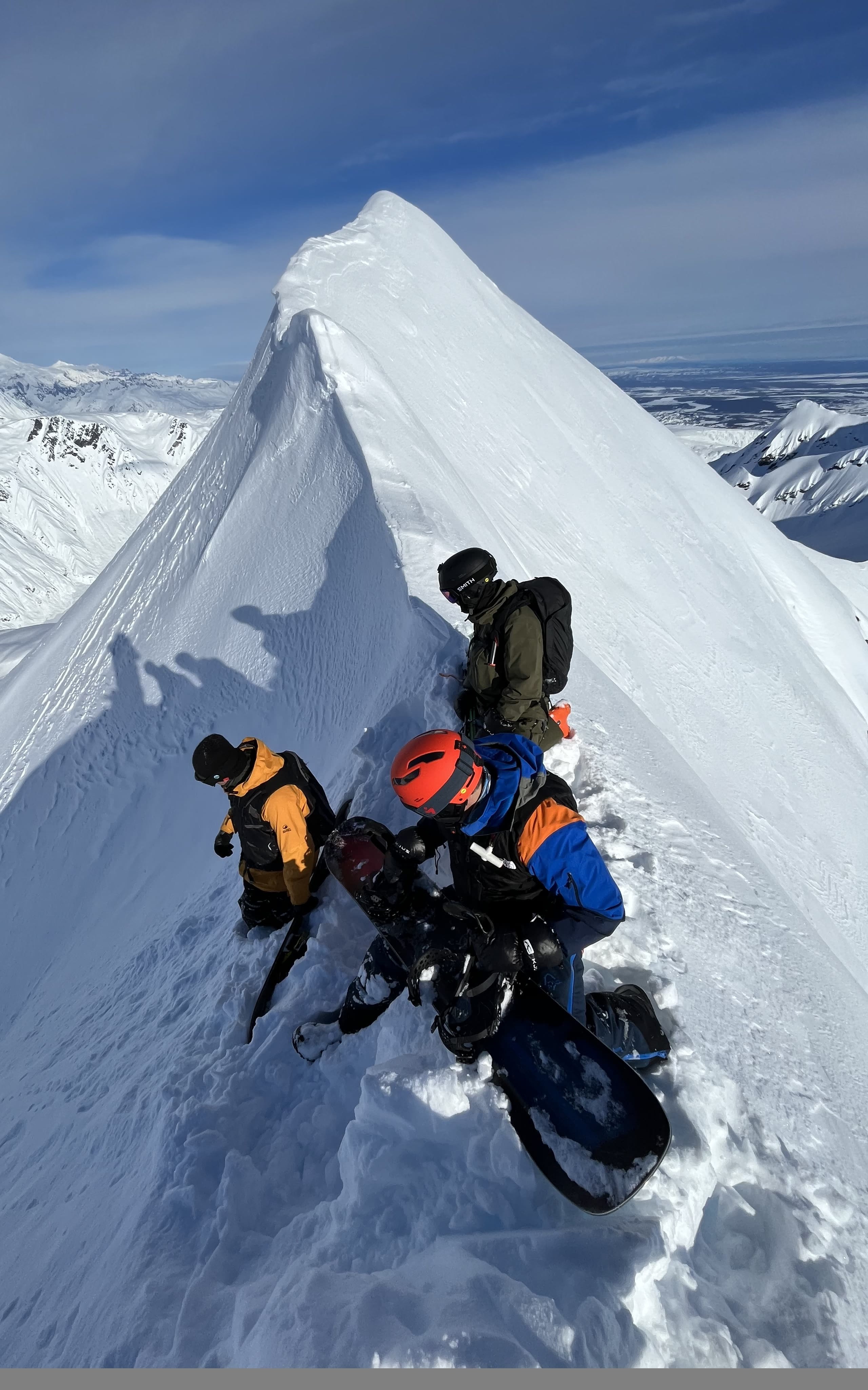SMG guides and guests preparing on a snowy Alaska ridge